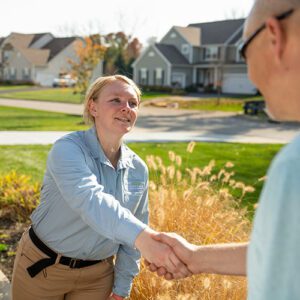 Technician shaking customers hand